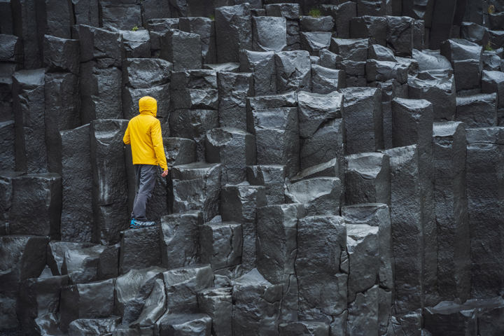 Man On Black Rock Formations In Iceland 1419078