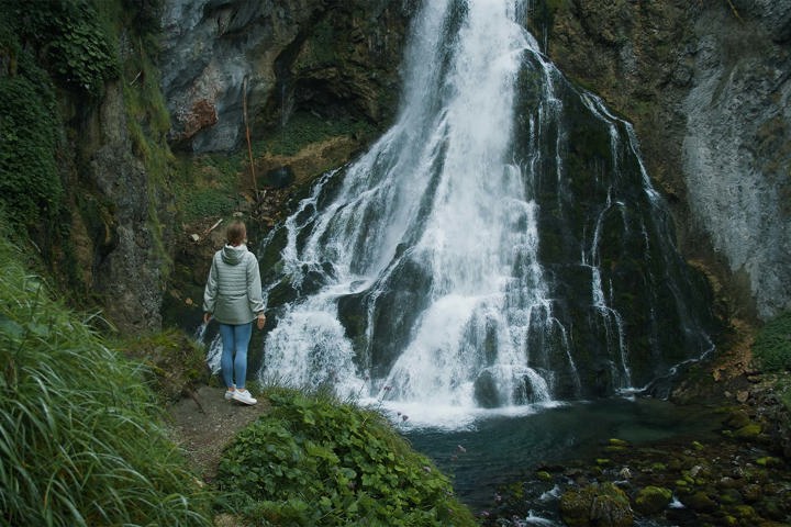 Woman Observes Gollinger Waterfall In Austria Original 1914691